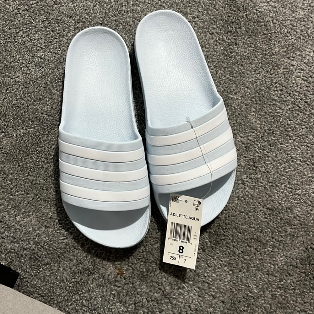 light blue Adidas slides